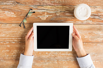 Image showing close up of female hands with tablet pc and coffee