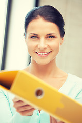 Image showing woman with folder