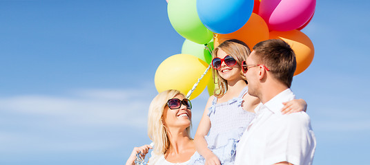 Image showing family with colorful balloons