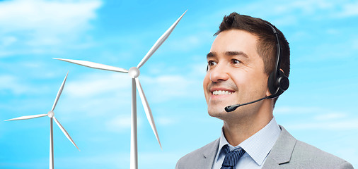 Image showing smiling businessman in headset