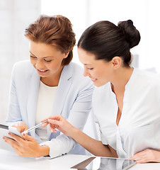 Image showing business team working with tablet pc in office