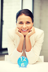 Image showing businesswoman with clock