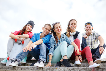 Image showing group of smiling teenagers hanging out