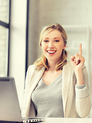 Image showing woman with laptop and finger up