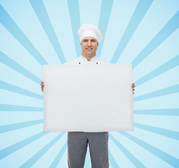 Image showing happy male chef cook holding white blank big board