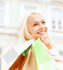 Image showing woman with shopping bags in ctiy