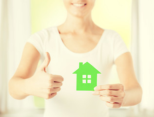 Image showing woman hands holding green house