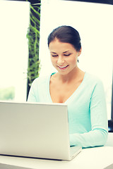 Image showing happy woman with laptop computer