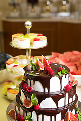 Image showing Chocolate cake with figs and raspberries