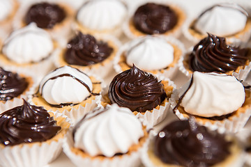 Image showing white and black meringue cookies.