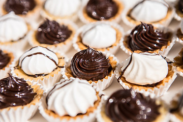 Image showing white and black meringue cookies.