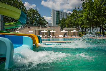Image showing person riding down a water slide