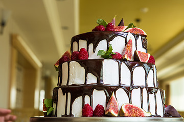 Image showing Chocolate cake with figs and raspberries