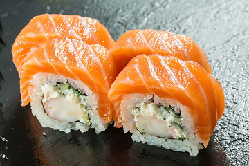 Image showing Salmon and caviar rolls served on a plate