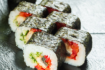 Image showing Salmon and caviar rolls served on a plate