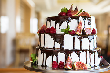 Image showing Chocolate cake with figs and raspberries