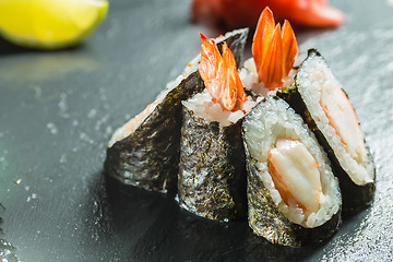 Image showing Rolls with shrimp on the black