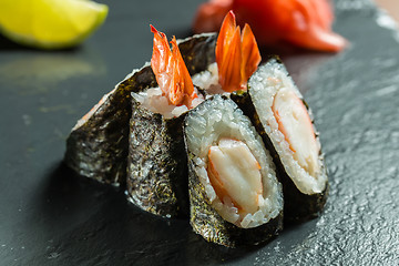 Image showing Rolls with shrimp on the black