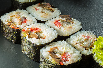 Image showing Salmon and caviar rolls served on a plate