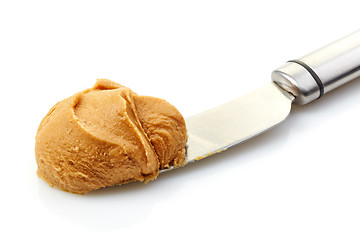 Image showing peanut butter spread on a knife