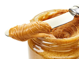 Image showing peanut butter spread on a knife