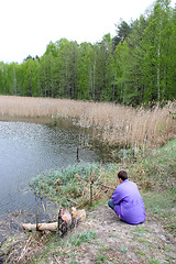 Image showing fisherman beside forest lake