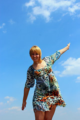 Image showing blue-eyed sympathetic girl and blue sky