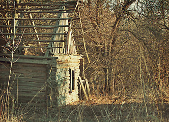 Image showing Abandoned and ruined house in an overgrown forest .