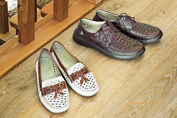 Image showing Two pairs of comfortable shoes : for men and for women.