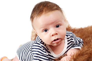 Image showing Portrait of adorable baby boy lying on fur