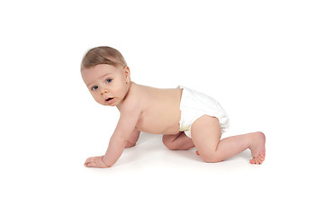 Image showing Side view of pretty crawling baby