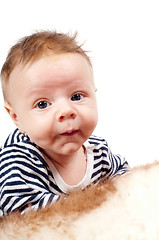 Image showing Portrait of cute child lying on fur