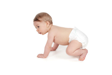 Image showing Side view of pretty crawling baby