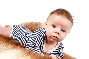 Image showing Portrait of adorable baby boy lying on fur