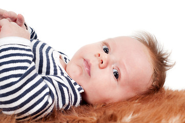 Image showing Adorable baby lying on fur