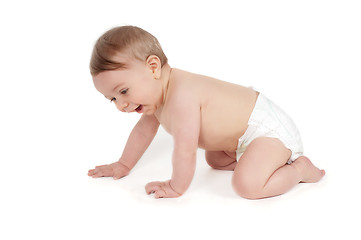 Image showing Side view of pretty crawling baby