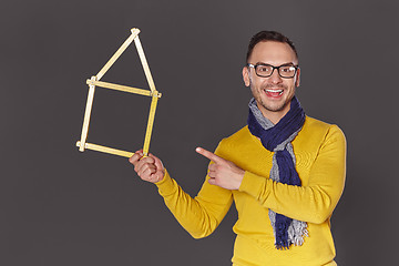 Image showing Man showing house frame concept