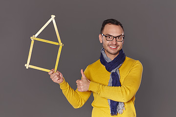 Image showing Man showing house frame concept