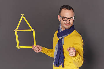 Image showing Man showing house frame concept