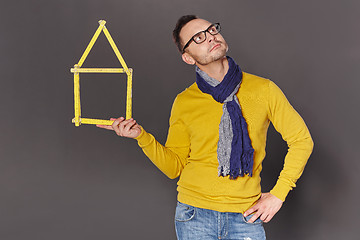 Image showing Man showing house frame concept