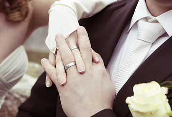 Image showing Hands with silver wedding rings