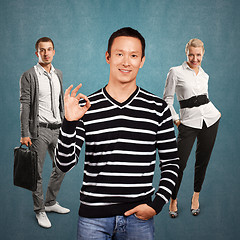 Image showing Teamwork and Asian Man In Striped Pullover