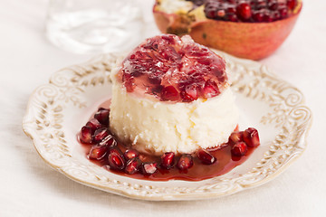 Image showing coconut panna cotta dessert with pomegranate