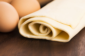 Image showing homemade dough on a wooden board 