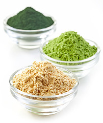 Image showing three bowls of various superfood powders