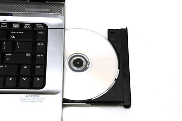 Image showing Open laptop CD-ROM drive on a white