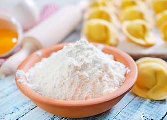 Image showing flour and raw pelmeni