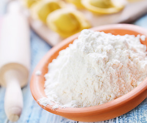 Image showing flour and raw pelmeni