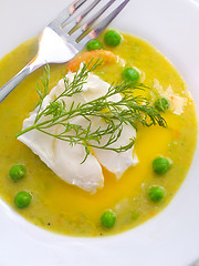 Image showing Fresh soup from green peas and egg-poached