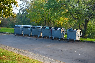 Image showing Dumpsters by the walking path